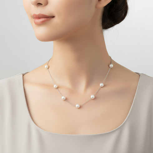 Necklace with seven 7-8mm white freshwater pearls in tincup design on a delicate chain