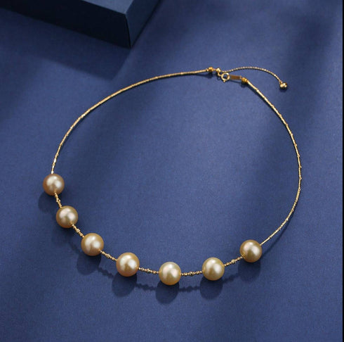 Tincup necklace with seven 12–13mm Golden South Sea pearls on an 18K gold chain