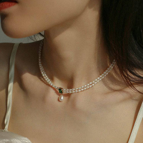 Double-strand white freshwater pearl necklace with emerald pendant and pearl drop