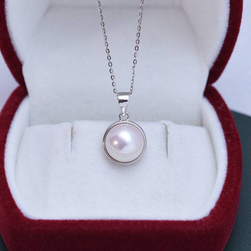 Necklace 10–11mm Freshwater Mabel Pearl & Ada by House of Pearls-JT, silver-bezel pearl pendant on silver chain.