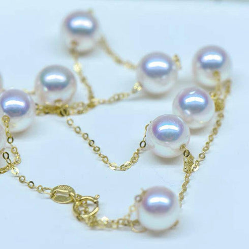 Pearl tincup necklace with 7–8mm white freshwater pearls on an 18K gold chain