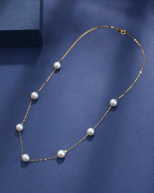 Necklace with seven white freshwater pearls on an 18K gold tincup chain by House Of Pearls XM.