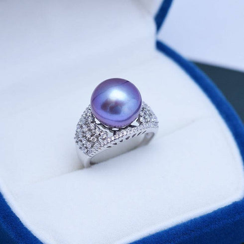 Ring featuring 12-13mm purple freshwater pearl and CZ pavé wide band