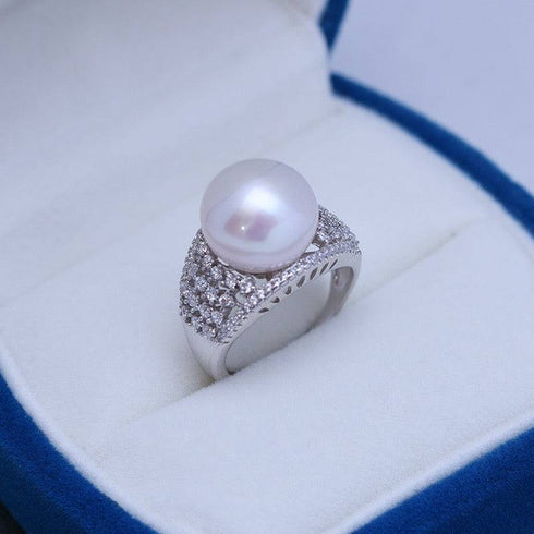 12-13mm Freshwater Pearl & Shine CZ Wide Ring featuring a large white pearl and pave CZ accents on a wide silver band.