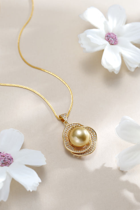 Gold pendant necklace featuring a 10–11mm Golden South Sea pearl surrounded by a diamond halo