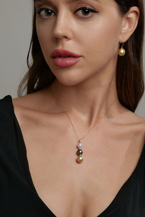 Earrings: House of Pearls Golden South Sea Pearl AAAA, 10-11mm drop pearl on gold hoop.