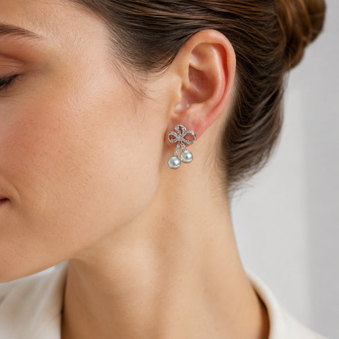Earrings: 7–8mm Japanese Akoya silver-blue pearls in a Celestial Bow Duo Drop design