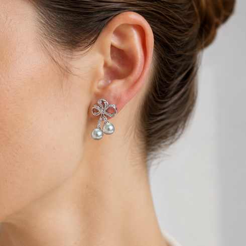 Earrings: 7–8mm Japanese Akoya silver-blue pearls in a Celestial Bow Duo Drop design