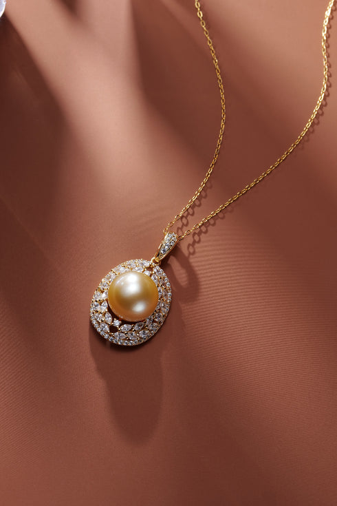 AAA Grade 10-11mm Golden South Sea pearl halo pendant on a gold chain necklace.