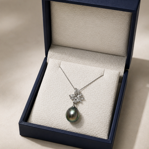 Necklace with 11–12mm Tahitian baroque pearl pendant and floral CZ accents in sterling silver, House of Pearls.