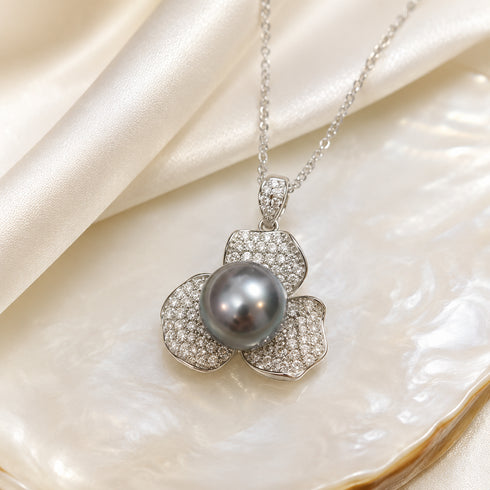 House of Pearls Tahitian Pearl flower pendant necklace with 10–11mm dark pearl and pave-diamond petals on silver chain.