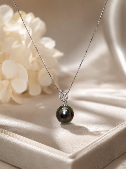 Necklace: 10-11mm Tahitian pearl with a CZ leaf pendant on a sterling silver chain, House of Pearls.