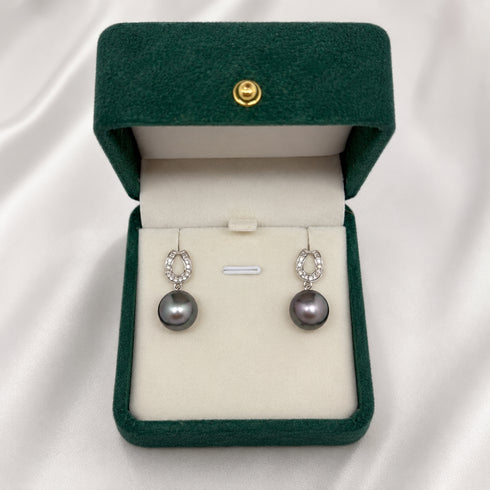 Pair of Tahitian South Sea Lunar Arch earrings with diamond-embellished silver arches and drop pearls.
