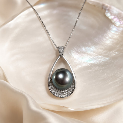 Necklace pendant by House of Pearls featuring 11–12mm Tahitian Ocean Tear pearl in a diamond-accented silver teardrop.