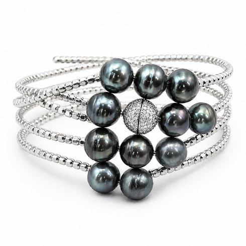 Bracelet: 10–12mm AAA Tahitian circled pearls on a layered silver cuff with a pavé bead centerpiece