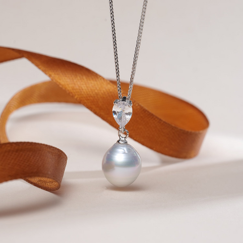 Necklace with 10-12mm white South Sea baroque pearl pendant on a silver chain with a clear crystal accent