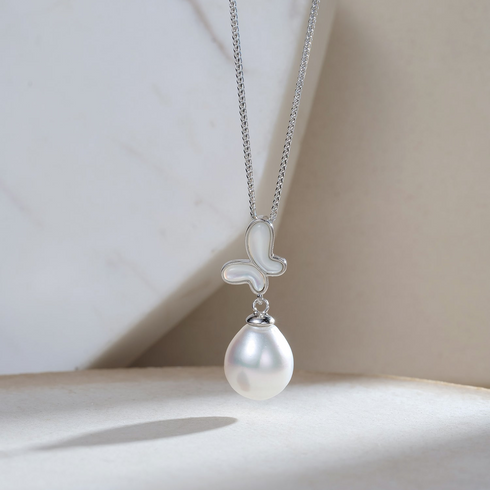 White South Sea Baroque Pearl butterfly pendant necklace on silver chain
