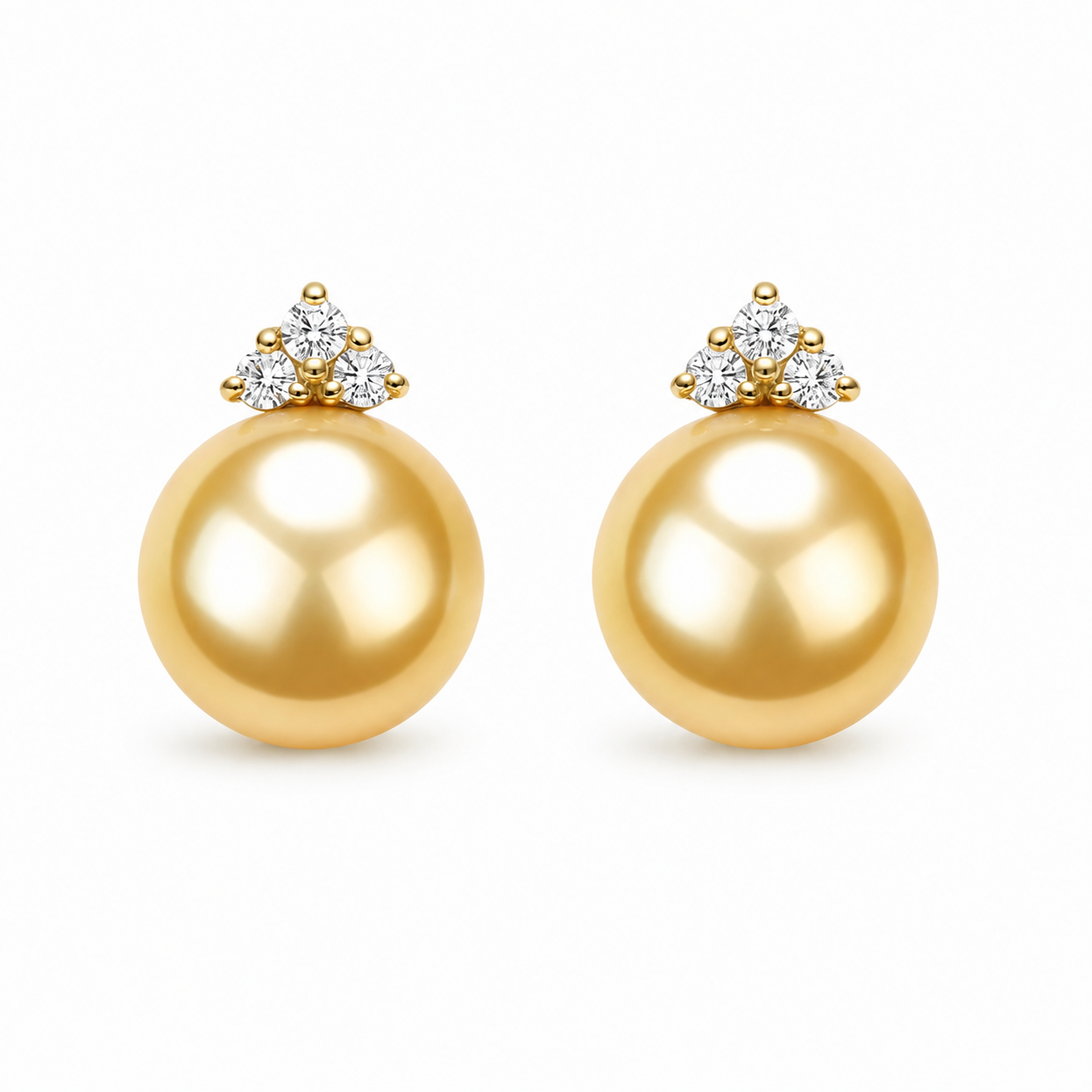 A pair of gold pearl stud earrings with a cluster of small clear gemstones at the top, shown on a clean white background.