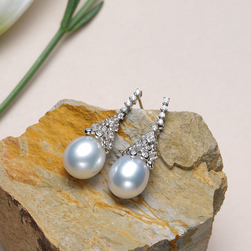 Earrings: Australian White South Sea oval pearl drops with diamond crown accents, House Of Pearls XM pair