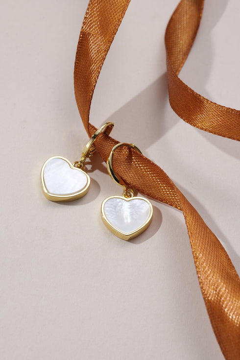 Earrings (2): gold-tone heart-shaped shell pendants with white mother-of-pearl centers