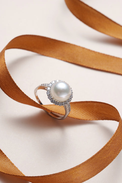 Freshwater Pearl Aurora Vine ring with a large white center pearl surrounded by a diamond halo on a silver band