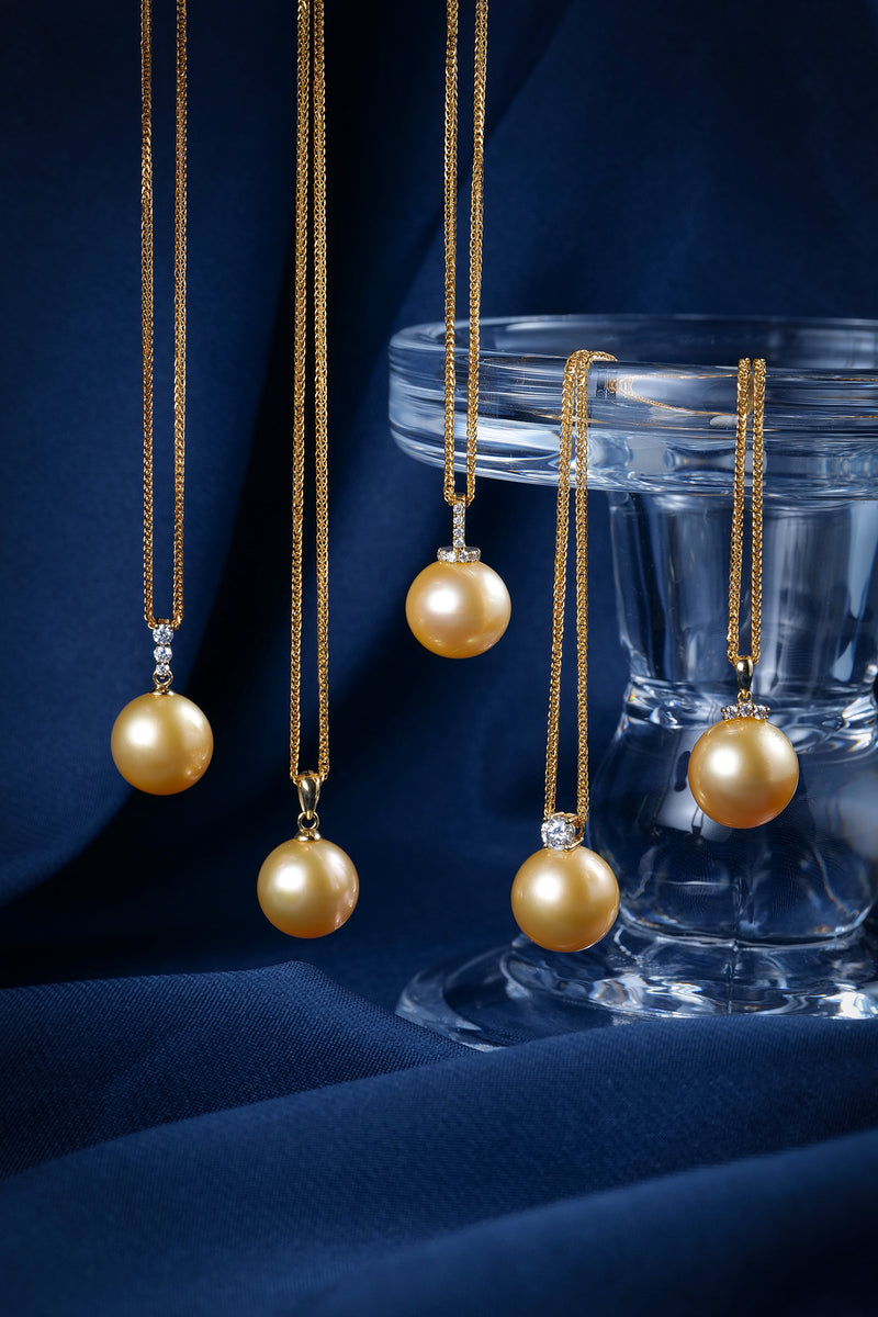 12-13mm Golden South Sea Pearl Triple Accent Pendant Necklace display; five gold chain necklaces with diamond-accent pendants.