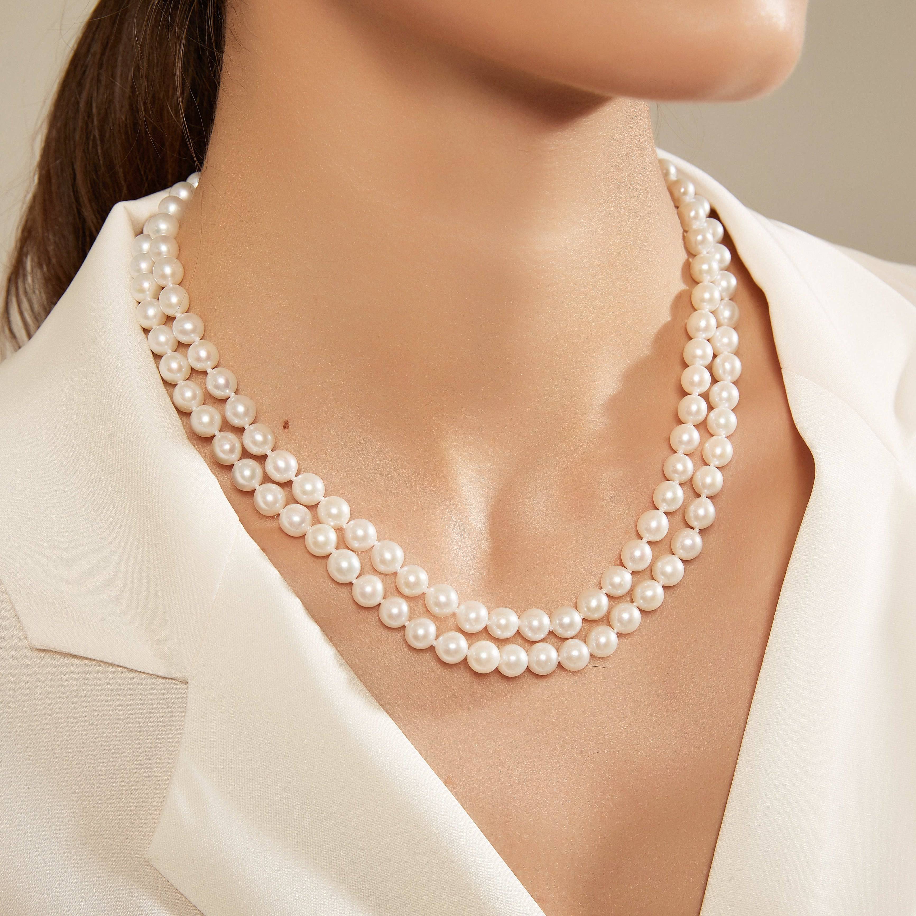 Brooch top double string pearl necklace